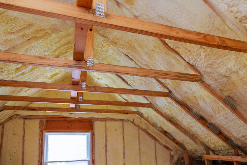 Fiberglass insulation installed in an attic